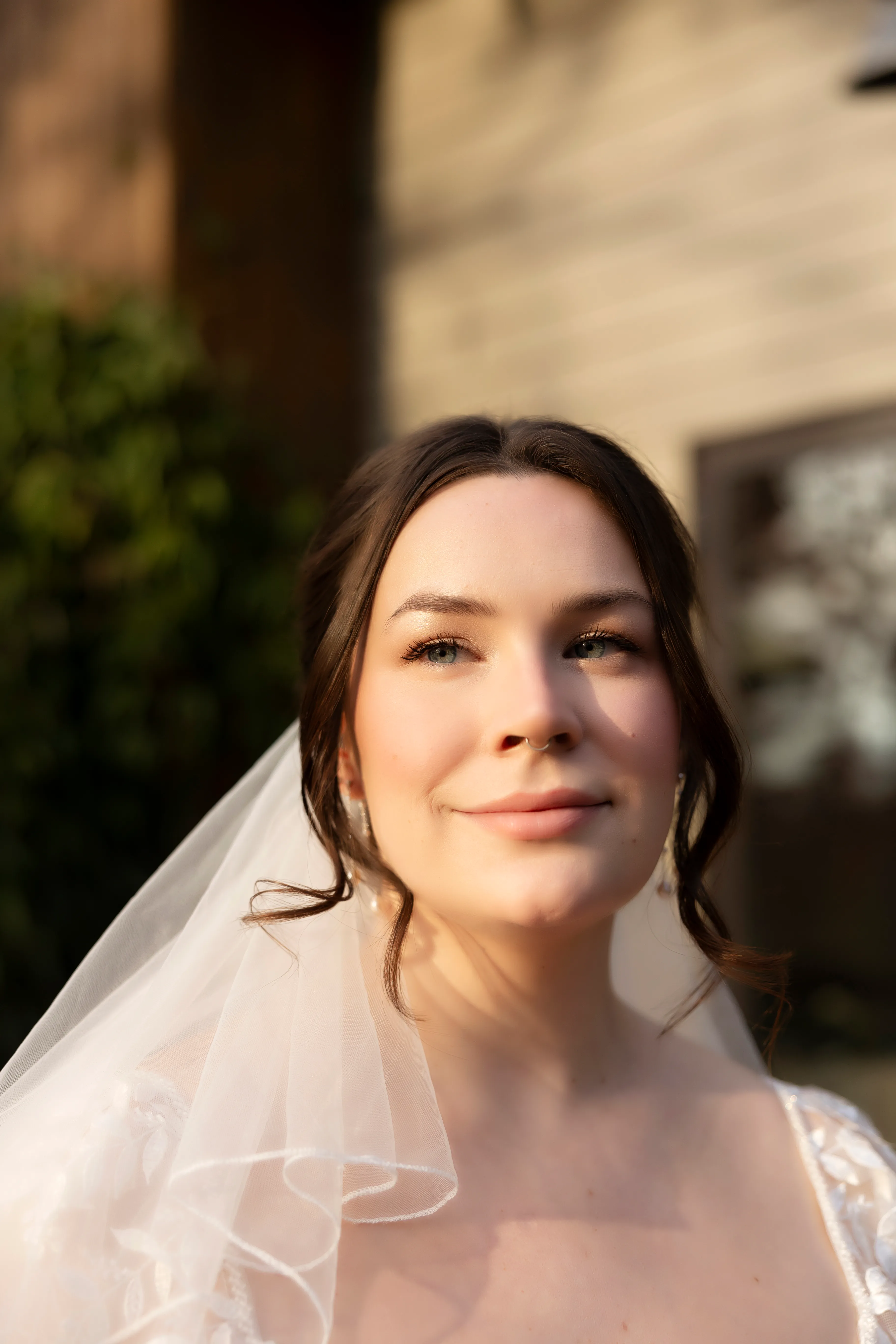 Bride portrait in golden hour light with veil